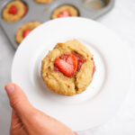 baby led weaning strawberry muffin on a white plate
