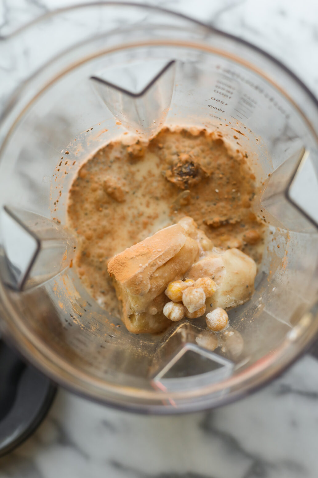 blender with chocolate protein smoothie ingredients